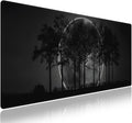 Wknoon. Extra Large Gaming & Office Mouse Pad (31.5" x 11.8") – Silhouetted Trees and a Mystical Moon, Premium XXL Desk Mat with Durable Stitched Edges & Anti-Slip Base & Smooth Fabric Surface