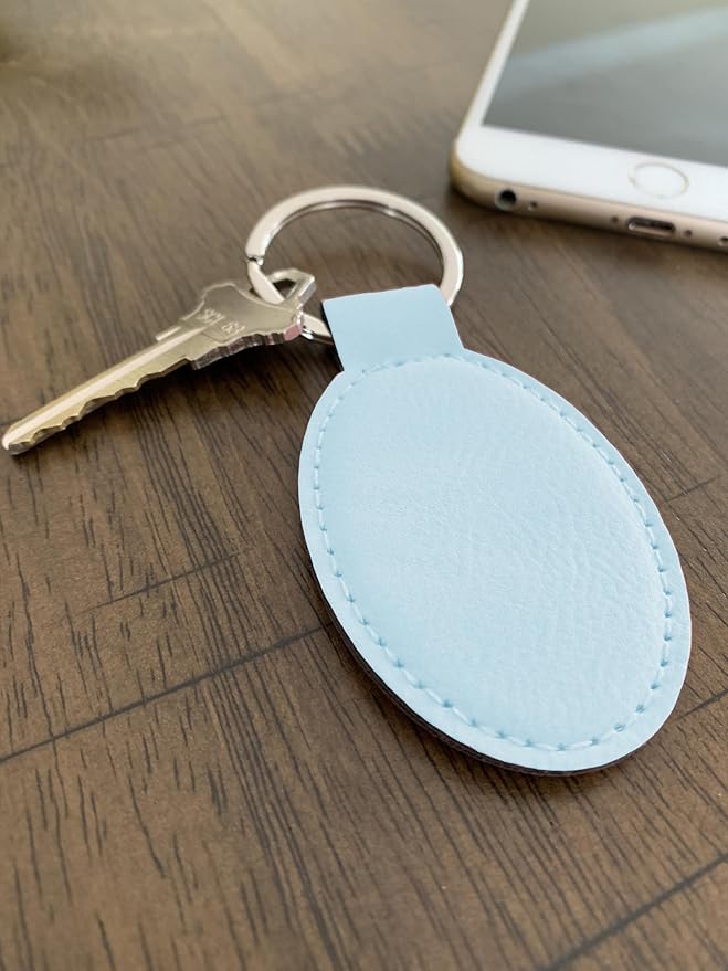 LaserGram Oval Keychain, Golfer Golfing, Personalized Engraving Included (Light Blue)